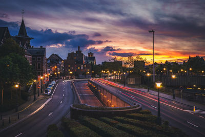 High angle view of light trails on road at night