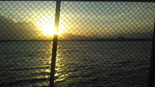 Chainlink fence seen through chainlink fence