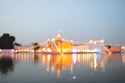 Reflection of illuminated buildings in water