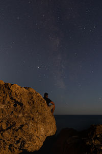 Scenic view of rocks against sky at night