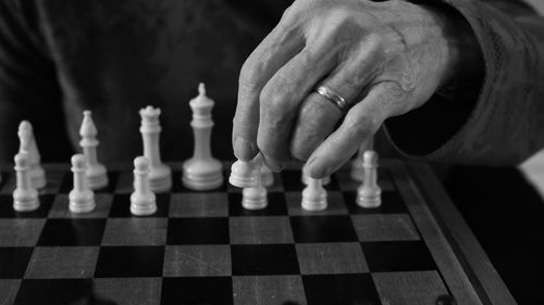 Woman playing on chess board