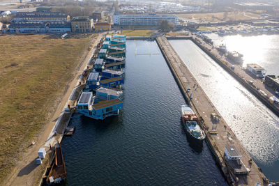 High angle view of river amidst buildings in city