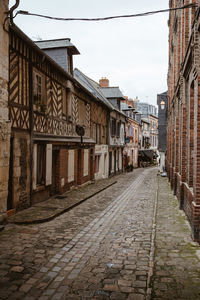 Footpath amidst buildings in town