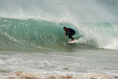 Man surfing in sea