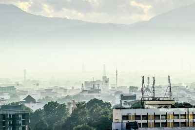 Buildings in city against sky