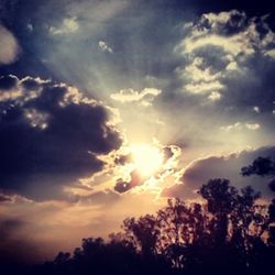 Low angle view of cloudy sky at sunset