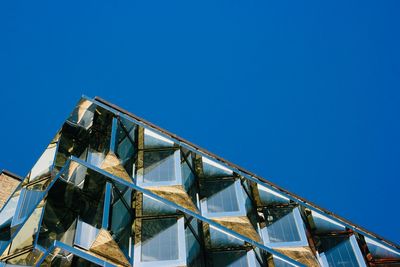 Low angle view of building against blue sky