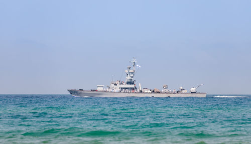 Ship sailing in sea against sky