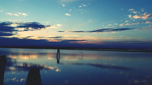 Scenic view of lake at sunset