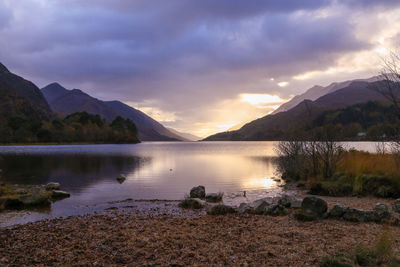 Scenic view of lake against sky during sunset