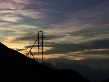 Silhouette mountains against sky during sunset