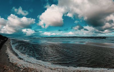 Panoramic view of beach against sky