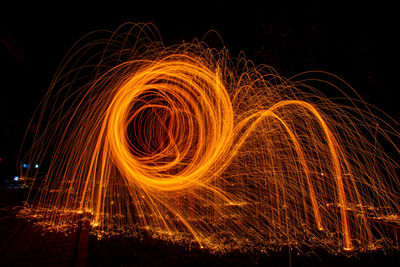 Light painting against sky at night