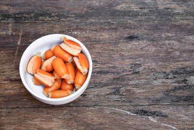 High angle view of chopped fruits in bowl on table