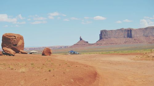 View of rock formations on landscape against sky