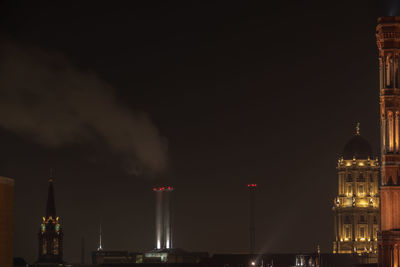 Illuminated buildings in city at night