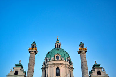 Low angle view of building against blue sky