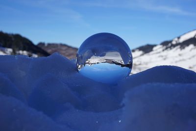 Close-up of frozen glass on mountain