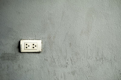 Close-up of electric light on wall