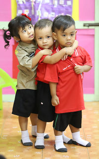 Two boys and people looking away