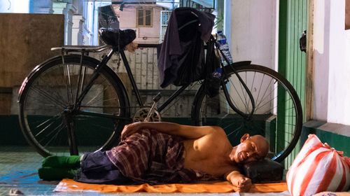 View of people sleeping on bicycle