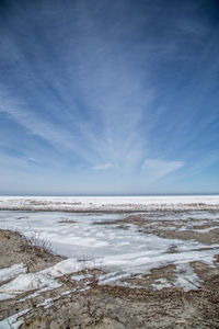 Scenic view of sea against sky during winter