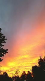 Low angle view of dramatic sky during sunset