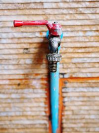 Close-up of pipes against wall
