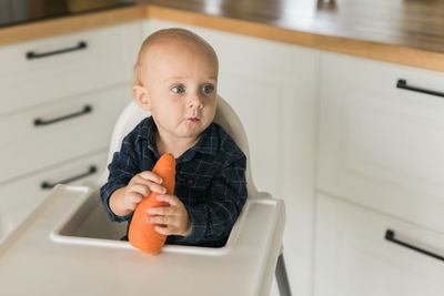 Portrait of boy playing in bathroom