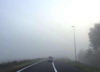 Car on road against clear sky