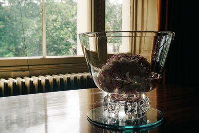 Close-up of glass bowl on table at home