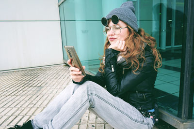 Young woman using mobile phone