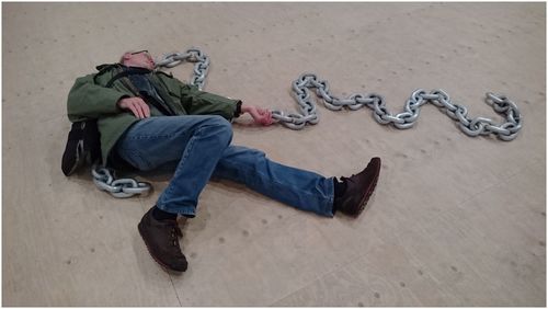 Full length of man lying on sand at beach