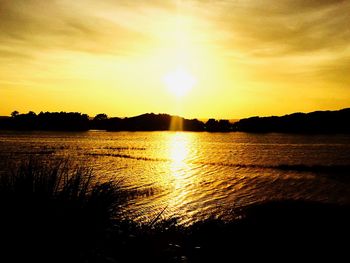 Scenic view of sunset over river