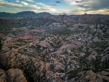 Aerial view of landscape against cloudy sky