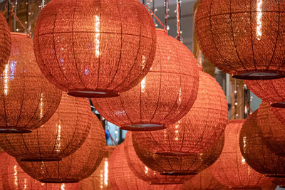 Low angle view of illuminated lanterns at night