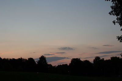 Silhouette trees against sky during sunset