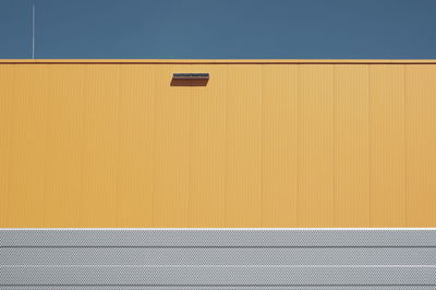 Full frame shot of yellow wall against building