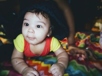 Close-up of cute baby boy looking away