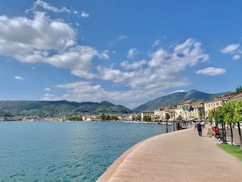 Scenic view of sea and buildings against sky