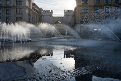 Fountain in city during winter