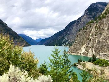 Scenic view of lake and mountains against sky