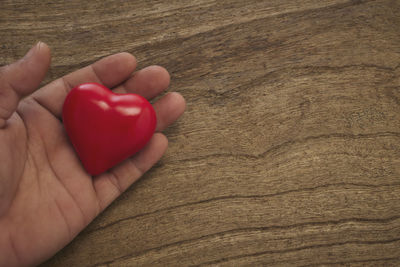Close-up of hand holding heart shape