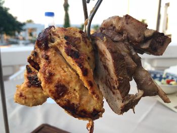 Close-up of meat on barbecue grill