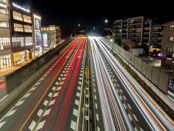 High angle view of light trails on road at night