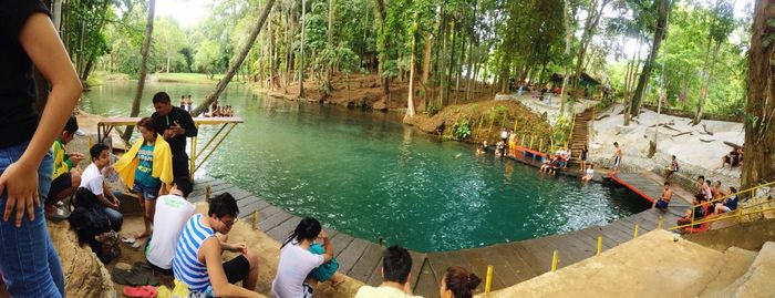 People at lake in forest