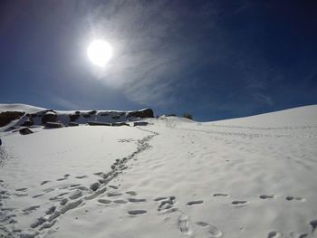 Scenic view of desert against sky during winter