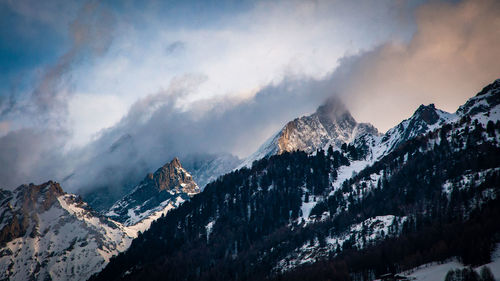 Panoramic view of snowcapped mountains against sky