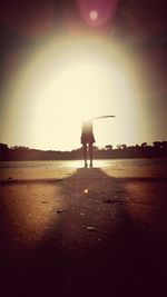 Full length of woman standing by railing