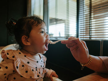 Portrait of cute girl bribe from her mother
